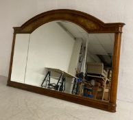 A large contemporary walnut and inlaid 19th century style overmantel mirror having a shaped and