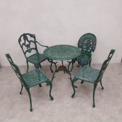 A 19th century style painted aluminium garden table and four similar chairs. Table Dia.67cm H.67cm