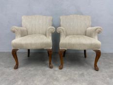 A pair of early 20th century George I style armchairs reupholstered in herringbone Andrew Martin