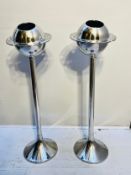 A pair of Art Deco style chrome ice buckets on stands with glass holder apertures to the rim. 90 x