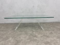 A vintage coffee table with plate glass top on acrylic base. H.36 W.110 D.60cm.