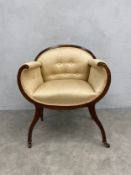 An Edwardian mahogany and satinwood inlaid tub chair. H.81 W.67cm