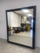 A large contemporary wall mirror in stained frame. 180x150cm.