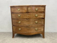 A Georgian mahogany bowfront chest with rosewood and satinwood inlay. H.105 W.108 D.58cm. (In need