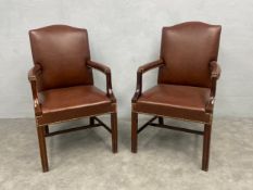 A pair of Georgian style Gainsborough library armchairs in studded leather upholstery on mahogany
