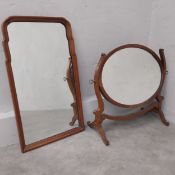 An early Georgian style walnut framed dressing mirror with easel stand and a 19th century mahogany