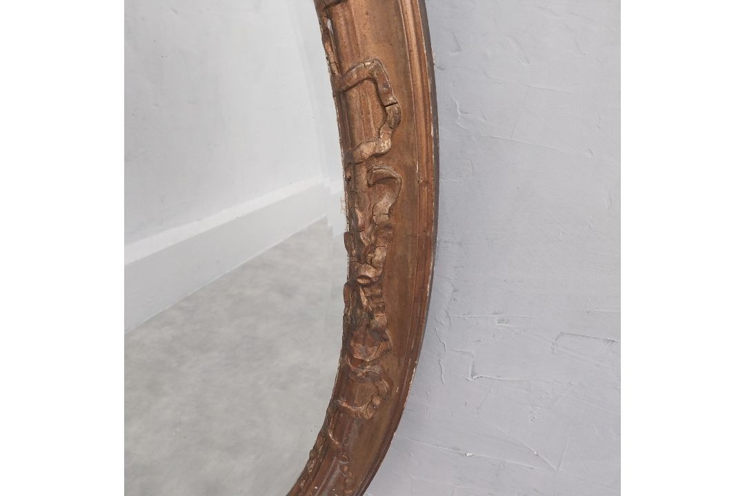 A late 19th century oval wall mirror in giltwood and foliate gesso frame. 92 x 65cm - Image 2 of 3