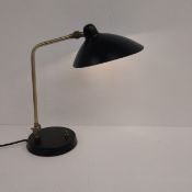A contemporary mid-century style brass and painted metal Milton table or desk lamp by Heal's with