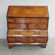An 18th century Dutch walnut bureau with profuse all-over marquetry inlay, the fall front