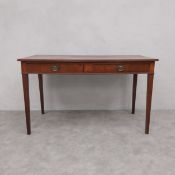 A 19th century mahogany writing table with a pair of frieze drawers on square section tapering
