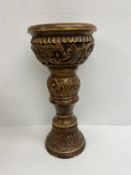 A carved and painted candlestand. H.50cm.
