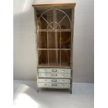 An Industrial style pine and galvanised metal cabinet with upper glazed section above drawers to