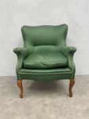 A mid century satin upholstered salon armchair on cabriole supports. H.92 W.73cm.