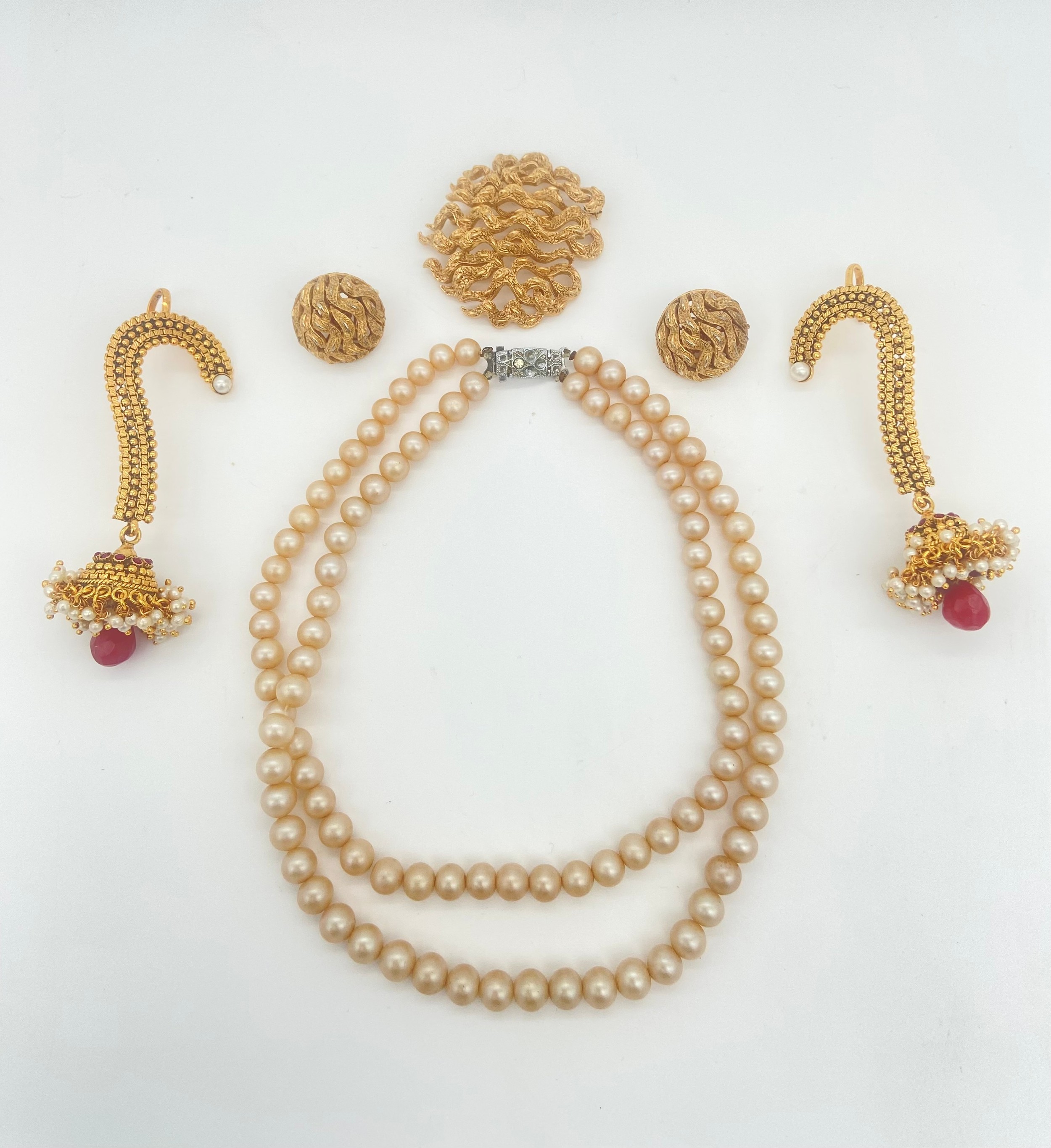 Trifari brooch and earring set, a pearl necklace and a pair of earcuffs, longest 34cm.