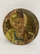 A 19th century hand painted Greek or Russian Orthodox icon on circular panel. Dia.25cm.