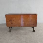 A 19th century mahogany drop flap dining table with gate-leg action on cabriole ball and claw
