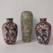 A pair of 20th century Japanese Imari vases along with a Murano style Millefiori glass vase. H.28