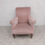 A 19th century armchair re-upholstered in blush velour on turned tapering mahogany supports