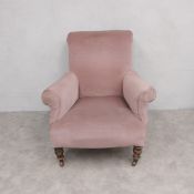 A 19th century armchair re-upholstered in blush velour on turned tapering mahogany supports