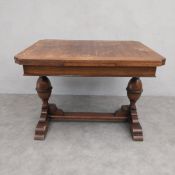 A mid-century oak draw leaf extending dining table in the Jacobean style. 80 x 107 x 84cm ext 168cm
