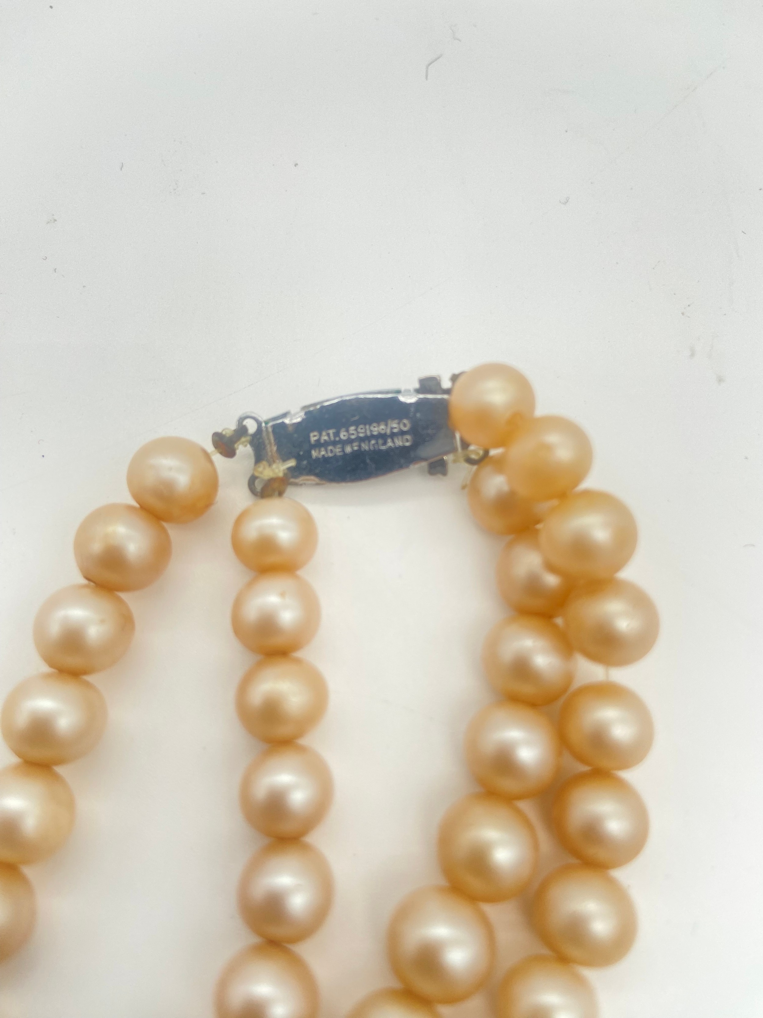 Trifari brooch and earring set, a pearl necklace and a pair of earcuffs, longest 34cm. - Image 4 of 5