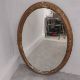 A late 19th century oval wall mirror in giltwood and foliate gesso frame. 92 x 65cm - Image 1 of 3