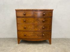 A Georgian mahogany bowfronted chest of drawers on swept bracket feet. H.102 W.103 D.51cm. (With