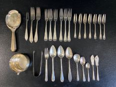 A mixed lot of hallmarked silver cutlery to include seventeen forks, six spoons, a pair of sugar