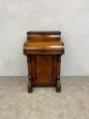 A 19th century burr walnut Davenport writing desk with piano top revealing fitted interior. H.98 W.