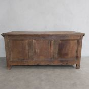An 18th century oak panelled coffer with hinged lid on stile supports. 59 x 125 x 50cm. (Back