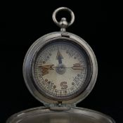 An early 20th century military issue pocket compass with a white, black and red dial in a polished