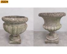 A C.1900 reconstituted stone garden planter of urn form with everted egg and dart moulded rim over a