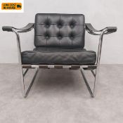 A C.2000 tubular chrome framed black leather lounge armchair, model HE 113 by Hans Eichenberger