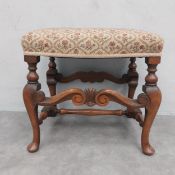 A walnut framed William and Mary style stool in tapestry upholstery. 49 x 52 x 40cm
