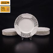 A set of fourteen late 19th century reticulated porcelain cabinet or serving plates with pierced