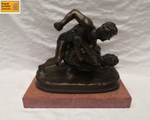 A 20th century bronze figure group by Oliver Tupton after the original ancient Roman marble