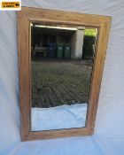 A 20th century gilt framed wall mirror with bevelled plate in a simple square frame. 85x54cm.