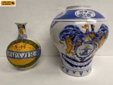 A large vintage tin glazed ceramic Delftware apothecary jar bearing the coat of arms of the