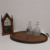 A pair of Georgian cut crystal decanters with original stoppers, one with white metal vine leaf