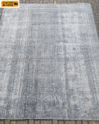 A large contemporary distressed style carpet. 304 x 204cm