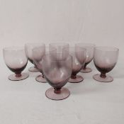 A set of eight purple amethyst twist or swirl glasses. H.12.5 Dia.9cm