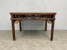 A C.1900 Chinese teak side table with pierced and carved frieze on circular section supports. H.80