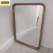 A contemporary oak framed Livorno wall mirror by Heal's with maker's plaque. 110 x 80cm