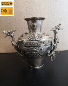 An early 20th century Chinese export silver plated Dragon vase of urn form with everted rim inset