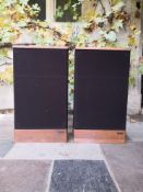 A pair of vintage teak cased Advent speakers with leads. H.72 W.42 D.26cm.