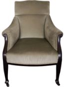 An Edwardian tub shaped mahogany framed library armchair. H.102cm.