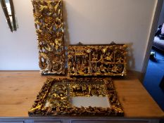 Two profusely carved Chinese gilt panels and a similar mirror. 60x40cm. (Mirror).
