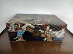 A Chinese lacquered box with painted figural court depictions fitted with carrying handles. H.17 W.