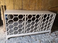 A contemporary lacquered sideboard with hexagonal mirrored panel doors. H.90 W.171 D.43cm.