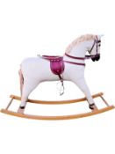 A retro styled rocking horse in corduroy. H.77 W.107cm.